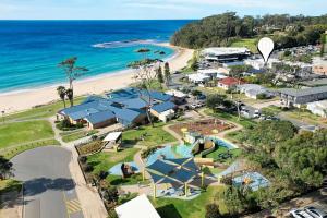 an aerial view of the resort and the beach at Beachfront Four in Mollymook