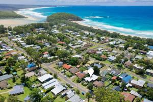 an aerial view of a suburb next to the beach at Villa Marie in Narrawallee