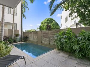 a swimming pool in the backyard of a house at Unit 2 Wai Cocos 215 Gympie Terrace Noosaville in Noosaville