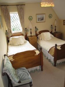 Katil atau katil-katil dalam bilik di Killyon Guest House