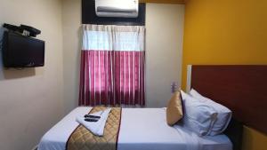 Postel nebo postele na pokoji v ubytování Skyry Hotels Adyar