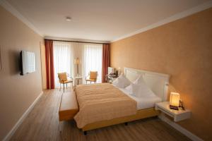 Postel nebo postele na pokoji v ubytování Hotel & Restaurant Alte Schule