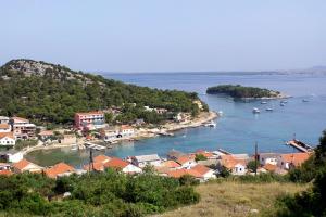 a view of a town with boats in the water at Holiday apartments Vrgada, Biograd - 4200 in Vrgada