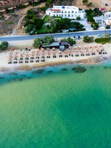 an aerial view of a beach with chairs and umbrellas at Filio Guesthouse in Kipri