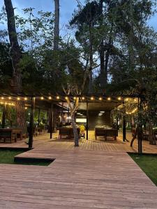 a pavilion with lights and benches in a park at Abna Hotel in Pizunda
