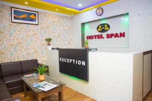 a hotel room with a hotel sign and a reception desk at Hotel Span in Butwāl