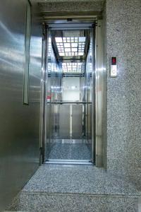 an elevator door in a building with the door open at Vander Valk İstanbul Hotel in Istanbul