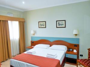 Postel nebo postele na pokoji v ubytování Hotel Riviera Fiumicino
