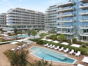 an aerial view of an apartment complex with a swimming pool at Luxury Apartment Jesolo in Lido di Jesolo
