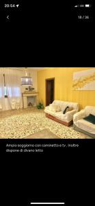 a bedroom with two beds and a fireplace at Azienda agricola Villa Giorgio in Torino di Sangro