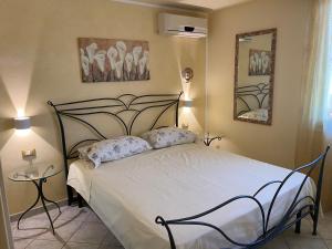 Postel nebo postele na pokoji v ubytování Casa Paola