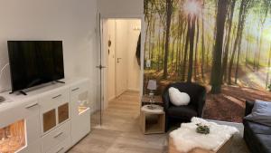 TV a/nebo společenská místnost v ubytování Waldläufer Brilon