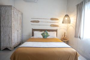 Postel nebo postele na pokoji v ubytování Gypsy Moon Bali