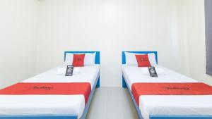 Letto o letti in una camera di RedDoorz @ Insular Square Mandaue City