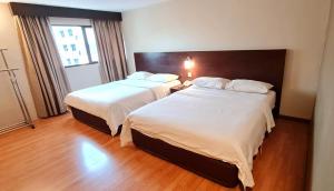Postel nebo postele na pokoji v ubytování PP Hotel