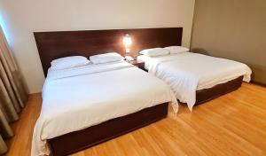 Postel nebo postele na pokoji v ubytování PP Hotel