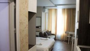 A bed or beds in a room at Colonel apartment Luxury