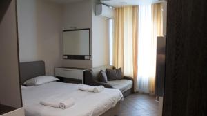 A bed or beds in a room at Colonel apartment Luxury