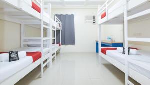 Letto o letti in una camera di RedDoorz @ Insular Square Mandaue City