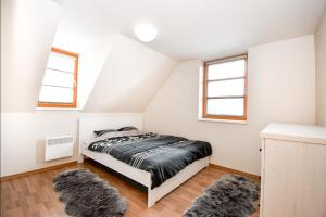 Postel nebo postele na pokoji v ubytování Apartmán s terasou