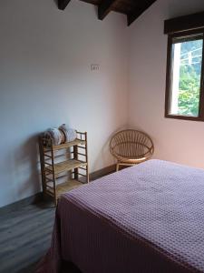 Giường trong phòng chung tại El Payarin tu casa apartamento en Asturias