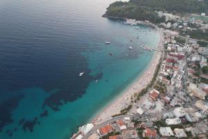 an aerial view of a beach with boats in the water at Dina House in Himare