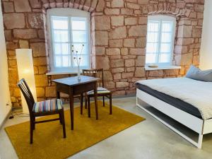 Postel nebo postele na pokoji v ubytování Auszeit - Historisches Ferienhaus in der Südpfalz