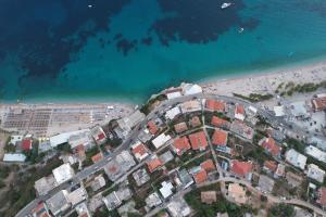 an aerial view of a city next to the beach at Dina House in Himare
