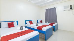 Letto o letti in una camera di RedDoorz @ Insular Square Mandaue City