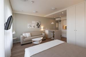 Televízia a/alebo spoločenská miestnosť v ubytovaní PENSION QUINTA EL RETIRO Habitación tipo Apartamento