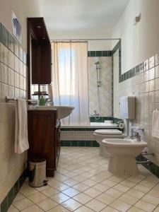 a bathroom with a toilet and a sink at Antonella B&B in Leuca