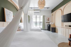 Postel nebo postele na pokoji v ubytování Bing Nong Homestay
