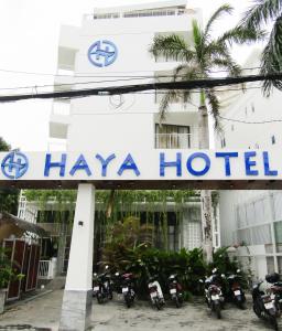 a hotel with motorcycles parked in front of it at HAYA Sea View Hotel Phu Quoc in Phú Quốc