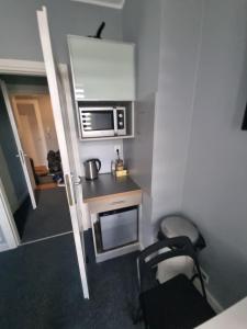 Kuchyň nebo kuchyňský kout v ubytování Apartamenty Duo