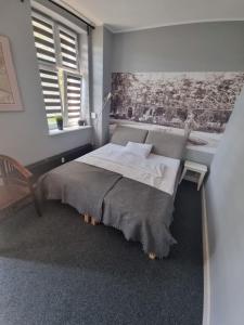 Postel nebo postele na pokoji v ubytování Apartamenty Duo