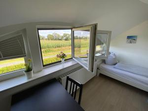 Postel nebo postele na pokoji v ubytování Etzel-Lodge Feldblick