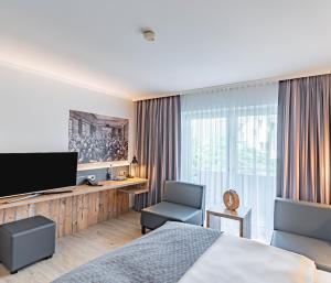 TV a/nebo společenská místnost v ubytování Parkhotel Sonnenberg