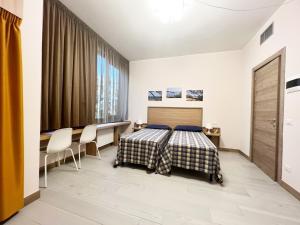 Posteľ alebo postele v izbe v ubytovaní Sissi Comfort Rooms Foresteria Lombarda