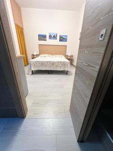 Posteľ alebo postele v izbe v ubytovaní Sissi Comfort Rooms Foresteria Lombarda