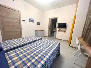Posteľ alebo postele v izbe v ubytovaní Sissi Comfort Rooms Foresteria Lombarda