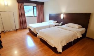 Postel nebo postele na pokoji v ubytování PP Hotel