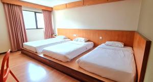 Postel nebo postele na pokoji v ubytování PP Hotel