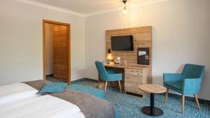 Voodi või voodid majutusasutuse Das Wiesgauer - Alpenhotel Inzell toas