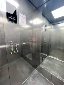 a shower with a glass door in a bathroom at Apartaments Turístics Conseller in Andorra la Vella