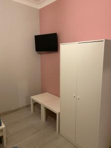 Televízia a/alebo spoločenská miestnosť v ubytovaní Aris Apartment