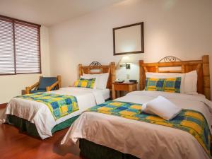 Postel nebo postele na pokoji v ubytování Armenia Hotel