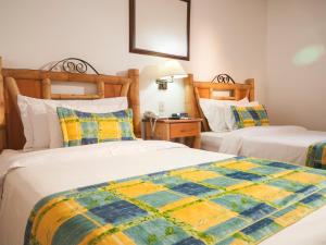 Postel nebo postele na pokoji v ubytování Armenia Hotel