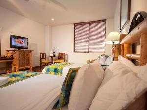 Postel nebo postele na pokoji v ubytování Armenia Hotel