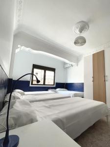 Ein Bett oder Betten in einem Zimmer der Unterkunft AZ The Zity Hostel - Coliving