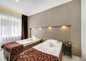 Кровать или кровати в номере Narva-Jõesuu Medical Spa